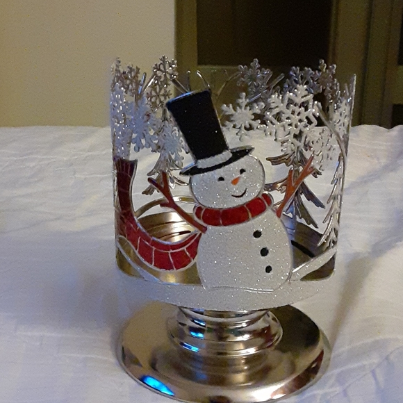 It's a Christmas pedestal 3 wick candle holder